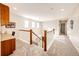 Upstairs hallway with carpet and a view of the staircase at 5808 S Duquesne Ct, Aurora, CO 80016