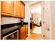 Wet bar with wine rack and mini-fridge at 5808 S Duquesne Ct, Aurora, CO 80016