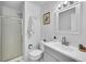 Neutral bathroom with gray vanity, tiled shower, and updated fixtures at 7918 S Depew St # D, Littleton, CO 80128