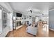 Spacious living room featuring fireplace, hardwood floors, and neutral color palette at 7918 S Depew St # D, Littleton, CO 80128