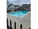 Community pool with fencing providing residents a comfortable recreation space at 7918 S Depew St # D, Littleton, CO 80128