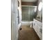 Well-lit bathroom featuring glass shower, tile floors and modern vanity at 8717 Forrest Dr, Highlands Ranch, CO 80126