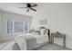 Bedroom with natural light, a ceiling fan, plush carpets, and decoratively appointed side tables at 8415 Pebble Creek Way # 102, Highlands Ranch, CO 80126
