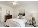 Cozy bedroom featuring neutral decor, a ceiling fan, and a dresser at 8415 Pebble Creek Way # 102, Highlands Ranch, CO 80126