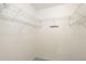 An empty walk in closet with metal shelving at 8415 Pebble Creek Way # 102, Highlands Ranch, CO 80126