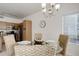 Charming dining area with a glass table, wicker chairs and plenty of natural light at 8415 Pebble Creek Way # 102, Highlands Ranch, CO 80126