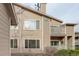 Condo building showcasing a two-story layout with balconies and well-kept landscaping at 8415 Pebble Creek Way # 102, Highlands Ranch, CO 80126