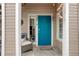 Charming entry with a vibrant blue door, potted plants, and a welcoming atmosphere at 8415 Pebble Creek Way # 102, Highlands Ranch, CO 80126