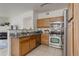 Updated kitchen with stainless steel appliances, granite countertops and ample cabinet space at 8415 Pebble Creek Way # 102, Highlands Ranch, CO 80126