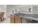 Modern kitchen with granite countertops, stainless steel appliances, and easy access to the dining area at 8415 Pebble Creek Way # 102, Highlands Ranch, CO 80126