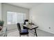 Bright office space with a modern glass desk and comfortable seating, bathed in natural light at 8415 Pebble Creek Way # 102, Highlands Ranch, CO 80126