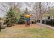Playground with play structure surrounded by green spaces and residential buildings at 8415 Pebble Creek Way # 102, Highlands Ranch, CO 80126