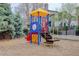 Well-maintained playground with play structure and seating area at 8415 Pebble Creek Way # 102, Highlands Ranch, CO 80126