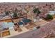 Great neighborhood and convenience in this aerial view of the house with a detached garage at 889 Douglas Dr, Denver, CO 80221