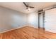 Bedroom featuring hardwood floors, a ceiling fan with lighting and closet at 889 Douglas Dr, Denver, CO 80221