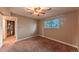 Bedroom with neutral carpet, a ceiling fan, and natural light from the window at 889 Douglas Dr, Denver, CO 80221