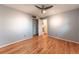 Bedroom featuring hardwood floors, a ceiling fan with lighting and a closet at 889 Douglas Dr, Denver, CO 80221