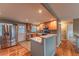 Contemporary kitchen featuring stainless steel appliances, a breakfast bar, and ample cabinet space at 889 Douglas Dr, Denver, CO 80221
