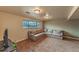 Finished basement featuring a large, comfortable sectional sofa and a window providing natural light at 889 Douglas Dr, Denver, CO 80221