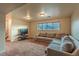 Basement area with a comfortable sectional and a mounted television at 889 Douglas Dr, Denver, CO 80221