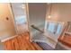 Warm and inviting entryway featuring a staircase with hardwood floors and modern lighting at 889 Douglas Dr, Denver, CO 80221