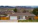 Charming brick home with mountain views, a two-car garage, and a cozy front patio at 4713 S Robb St, Littleton, CO 80127