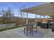 Back patio with seating area, covered space, and mountain views at 4713 S Robb St, Littleton, CO 80127