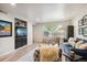 Living room with cozy seating arrangement and built-in shelving at 9283 E Arbor Cir # B, Englewood, CO 80111