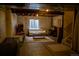 Unfinished basement featuring a cozy seating area and potential for customization to create your dream space at 15523 E 117Th Ave, Commerce City, CO 80022
