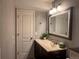 Nicely appointed bathroom featuring a vanity with drawers, a mirror, lighting, and a sink at 15523 E 117Th Ave, Commerce City, CO 80022