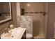 Clean bathroom with a sink and shower featuring decorative tile at 15523 E 117Th Ave, Commerce City, CO 80022