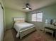 Comfortable bedroom featuring natural light, a vanity, and wooden blinds at 15523 E 117Th Ave, Commerce City, CO 80022