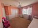 Cozy bedroom with neutral carpet, decorative chandelier, large closet, and natural light at 15523 E 117Th Ave, Commerce City, CO 80022