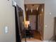An interior view of the entryway featuring a long mirror and coat rack at 15523 E 117Th Ave, Commerce City, CO 80022