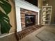 Charming brick fireplace with a decorative mantel, creating a warm and inviting atmosphere at 15523 E 117Th Ave, Commerce City, CO 80022