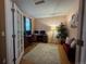 Cozy home office with a desk, computer setup, comfortable seating, and a bright window at 15523 E 117Th Ave, Commerce City, CO 80022
