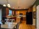 Spacious kitchen featuring wooden cabinets, stainless steel appliances, and a center island at 15523 E 117Th Ave, Commerce City, CO 80022