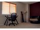 Well lit office with a modern glass desk, ergonomic chair, and accent chair and mirror at 15523 E 117Th Ave, Commerce City, CO 80022