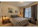 Comfortable bedroom with a window with shades and decor at 22820 E Chenango Ave, Aurora, CO 80015