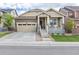 Charming single-Gathering home featuring a welcoming front porch and a well-maintained front yard at 22820 E Chenango Ave, Aurora, CO 80015