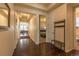 Inviting hallway leading to living areas and bedrooms, showcasing modern flooring and design at 22820 E Chenango Ave, Aurora, CO 80015