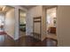 Open hallway with hardwood floors leads to bedrooms and bathrooms at 22820 E Chenango Ave, Aurora, CO 80015
