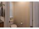 Cozy half bathroom with a window and a neutral color scheme at 22820 E Chenango Ave, Aurora, CO 80015