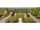 Scenic aerial view of a neighborhood highlighting lush landscaping and manicured common areas at 3143 Elmira St, Denver, CO 80238