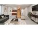 Spacious finished basement featuring a wet bar, open staircase and comfortable living area at 3143 Elmira St, Denver, CO 80238