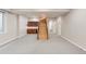 Spacious basement with staircase and wet bar area at 3143 Elmira St, Denver, CO 80238