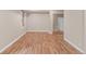 Well-lit bedroom featuring hardwood floors, a large window and a mirrored closet at 3143 Elmira St, Denver, CO 80238