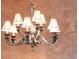 Close up of decorative chandelier with ornate lighting and traditional styling at 3143 Elmira St, Denver, CO 80238