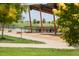 Picturesque community area with shaded seating, pond views, and green spaces for residents to enjoy at 3143 Elmira St, Denver, CO 80238