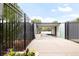 Entrance to the community pool showcasing a clean, well-maintained walkway and pool access at 3143 Elmira St, Denver, CO 80238
